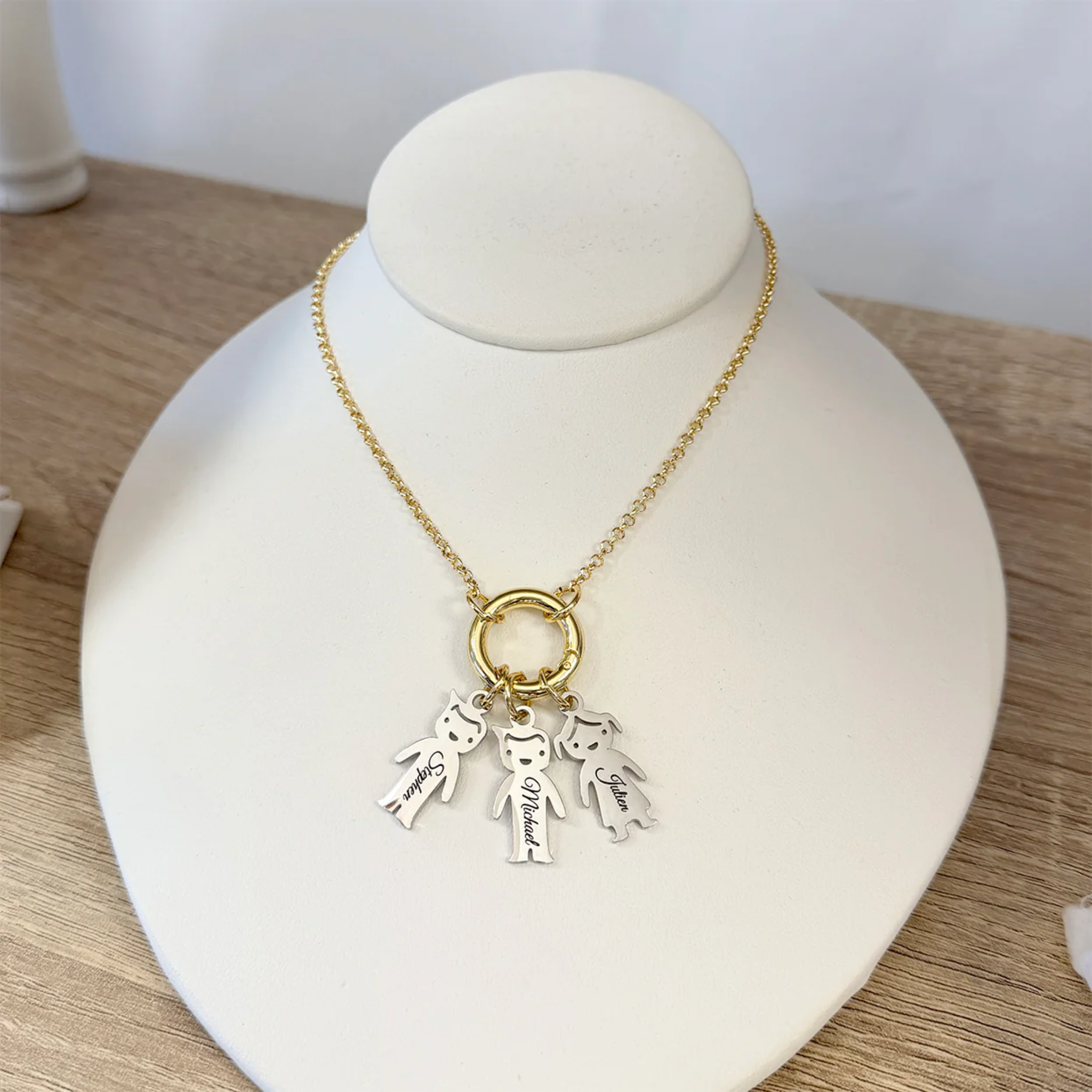 Personalized Grandma Kids Charm Necklace by Love Lisa featuring a heart and bow pendant with customizable charms.