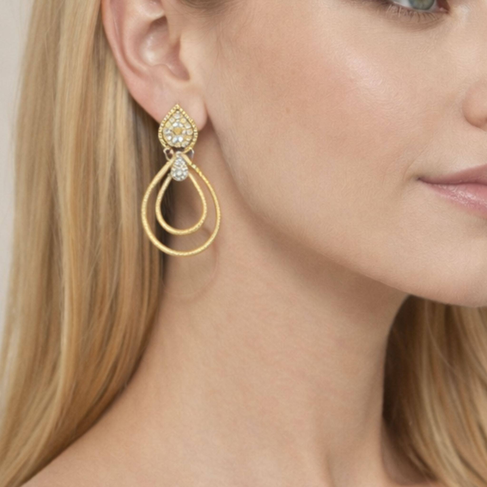 Sterling silver glam teardrop hoop earrings with a shiny finish, elegantly designed by Private Vendor.