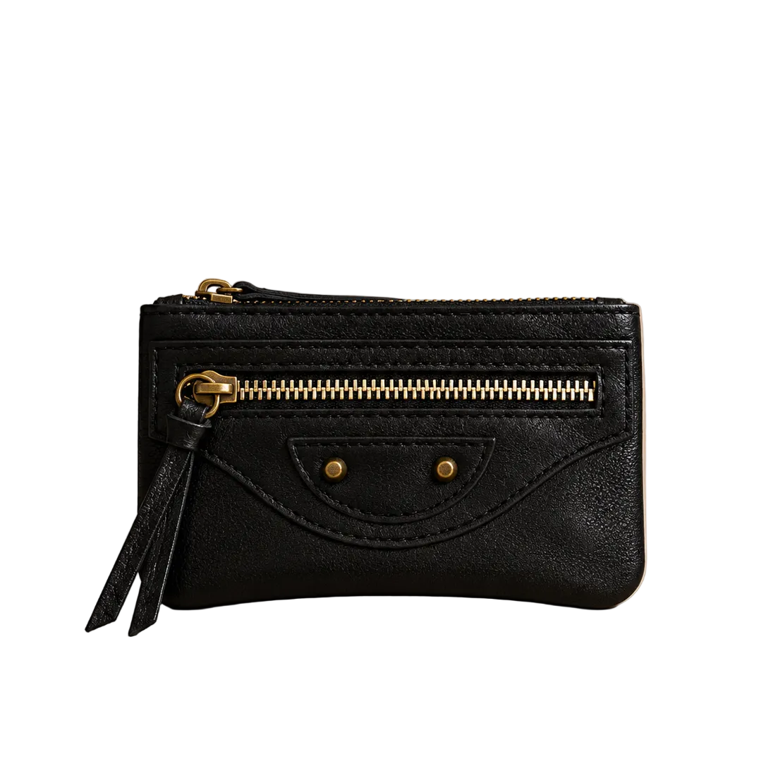 Black wallet with gold zipper and tassel on a beige background