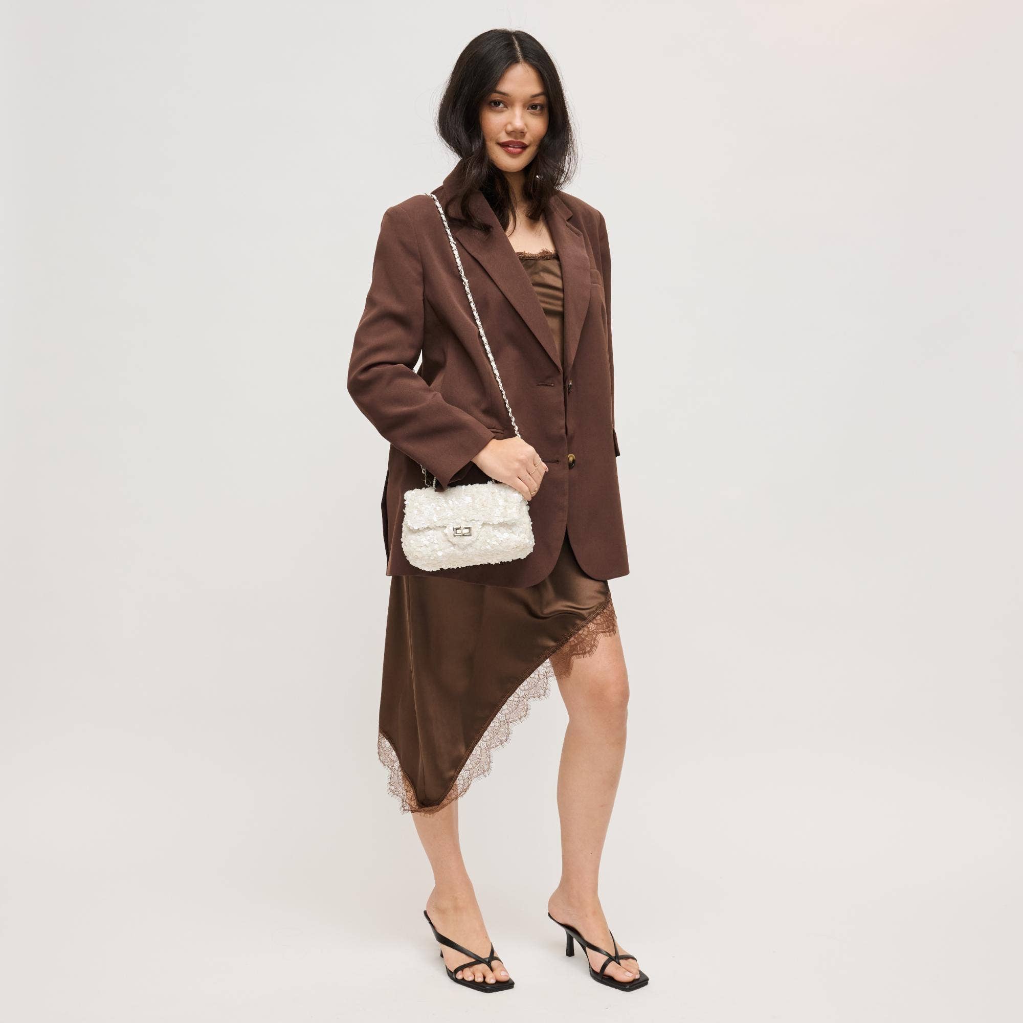 Urban Expressions Ella evening bag with sleek black leather and silver hardware, featuring a chain strap and elegant design.
