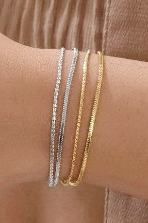 Tarnish-free stainless steel layered bracelet by Private Label Jewelry with intricate design and elegant finish.