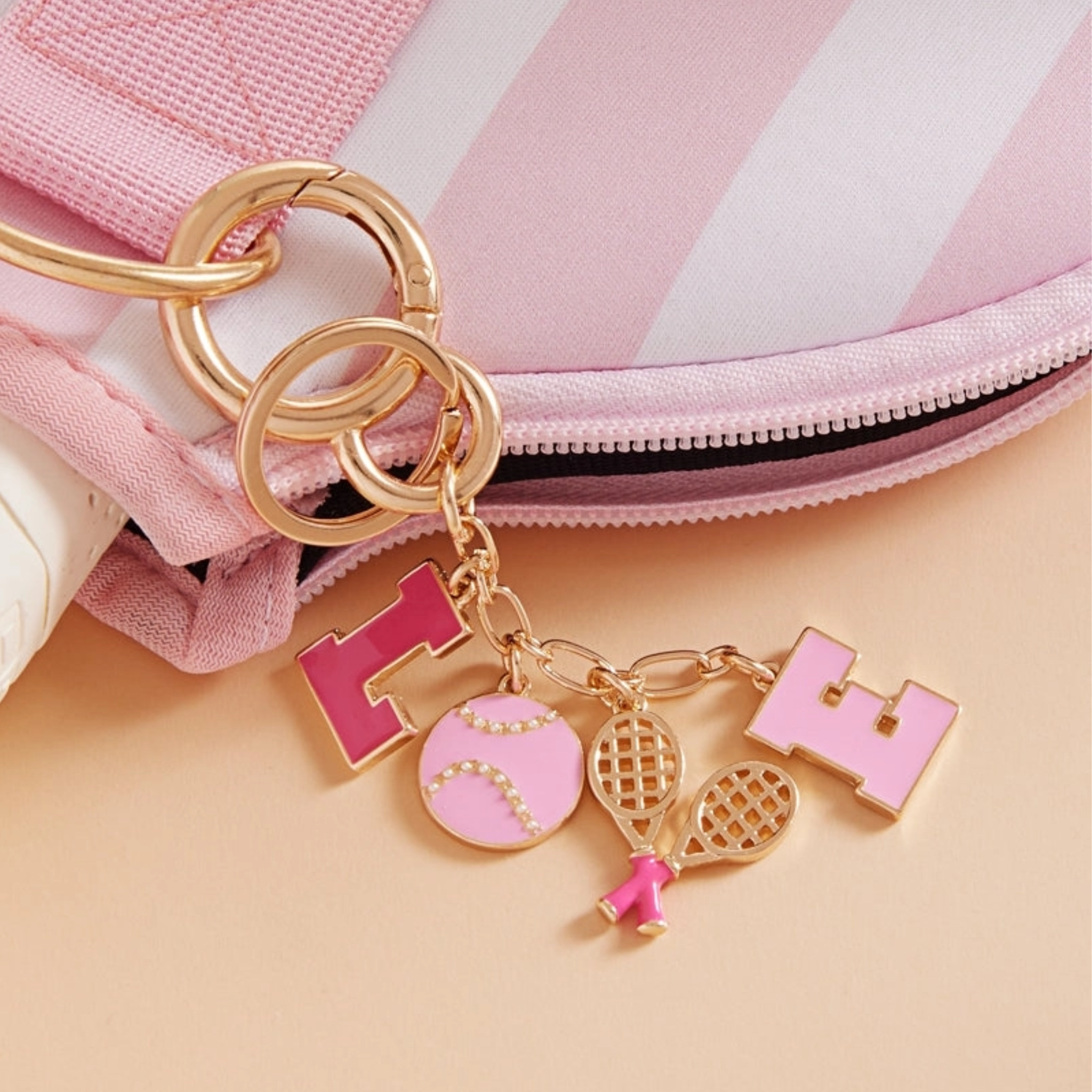 Multicolored sports love tennis icons bag charm and keychain by Private Label featuring tennis racquet and ball designs.