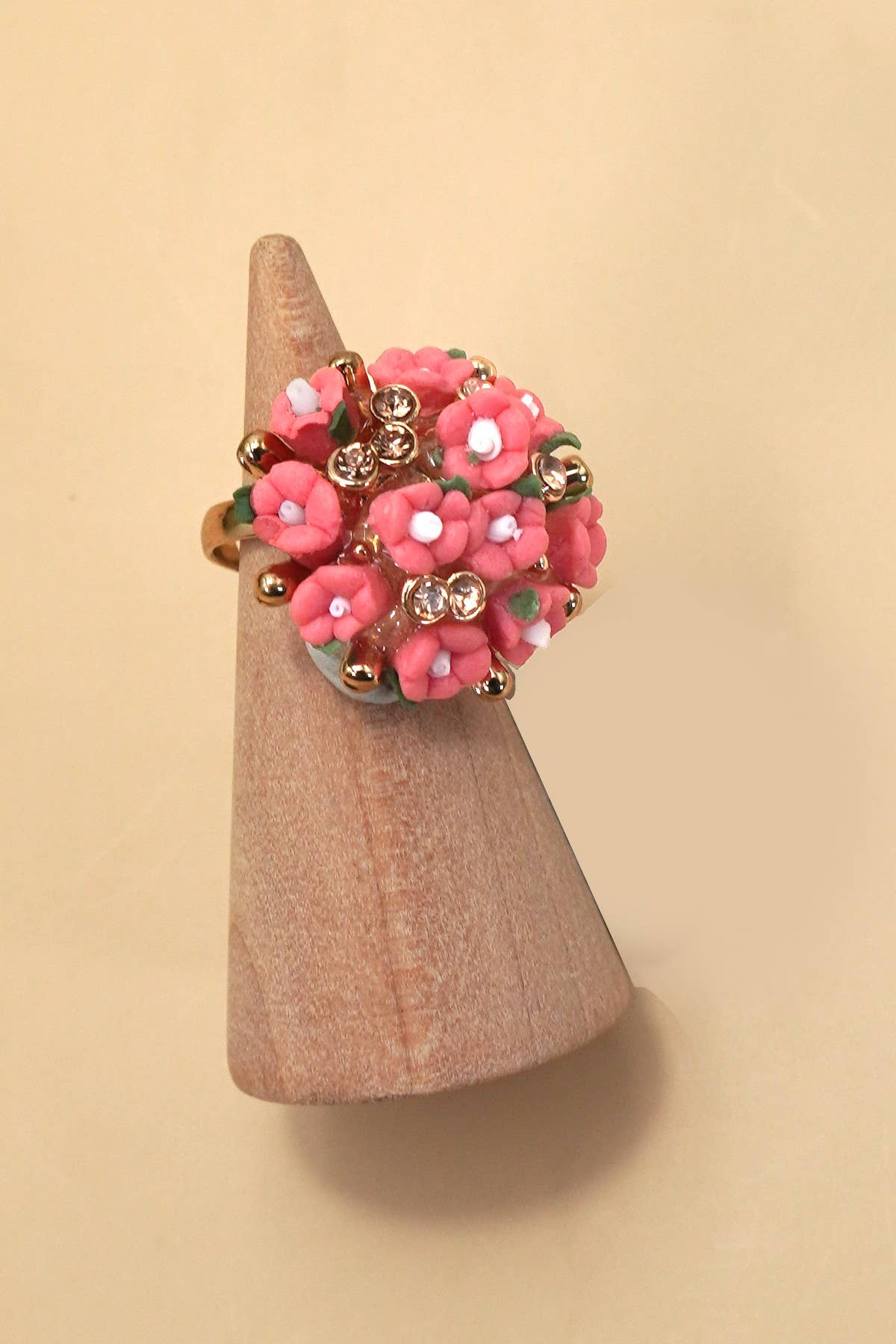 Private label Blossom Flower adjustable gold ring with delicate flower design, visible on a person's finger.