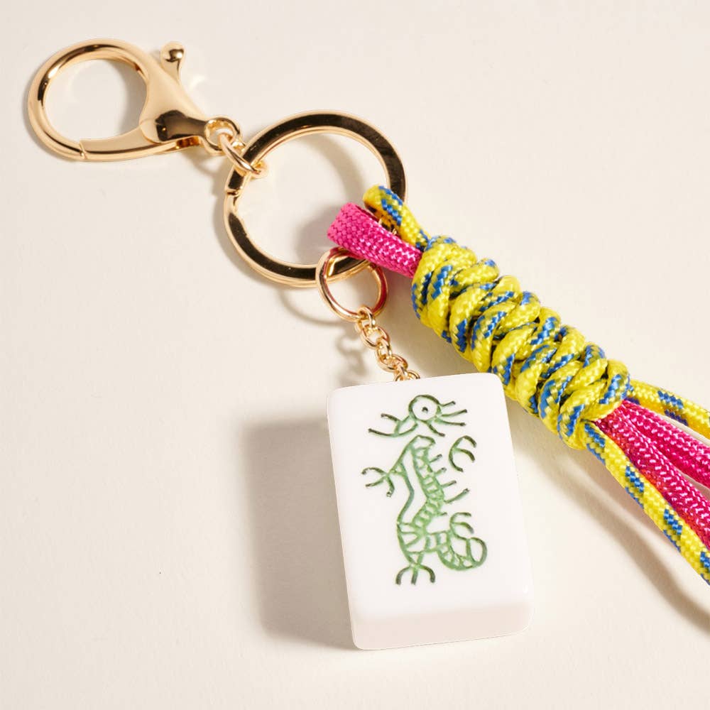 Mahjong tile knot strap drop keychain bag charm with colorful design, attached to a keyring and fabric strap.