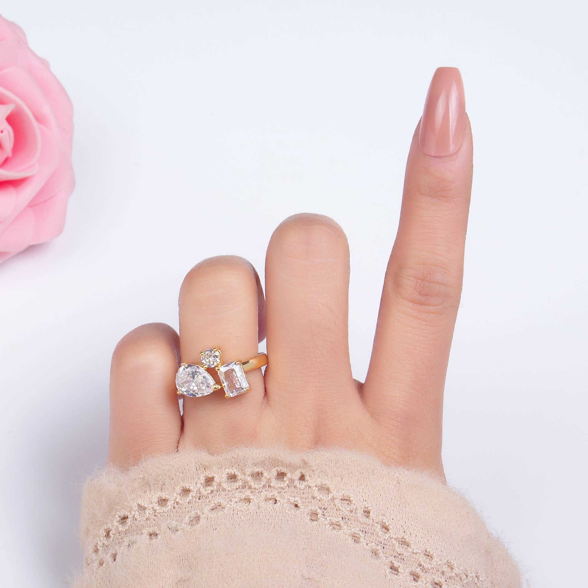 Dainty gold adjustable ring with multiple clear CZ stones, featuring various gemstone shapes, by Private Label.