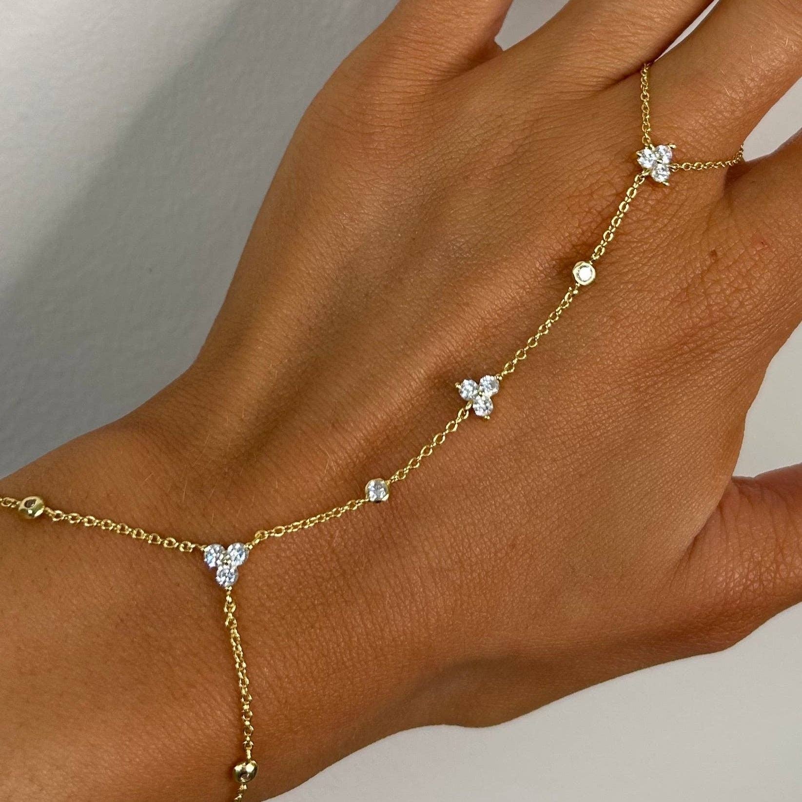 Elegant Kira hand chain bracelet by Sahira Jewelry Design, featuring intricate links and a stylish finish.