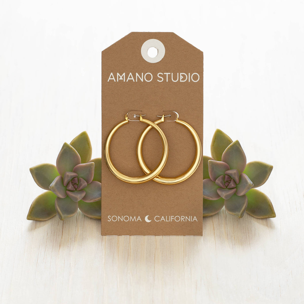 Large Maria Hoop earrings by Amano Studio featuring bold, circular gold hoops with a smooth, polished finish.