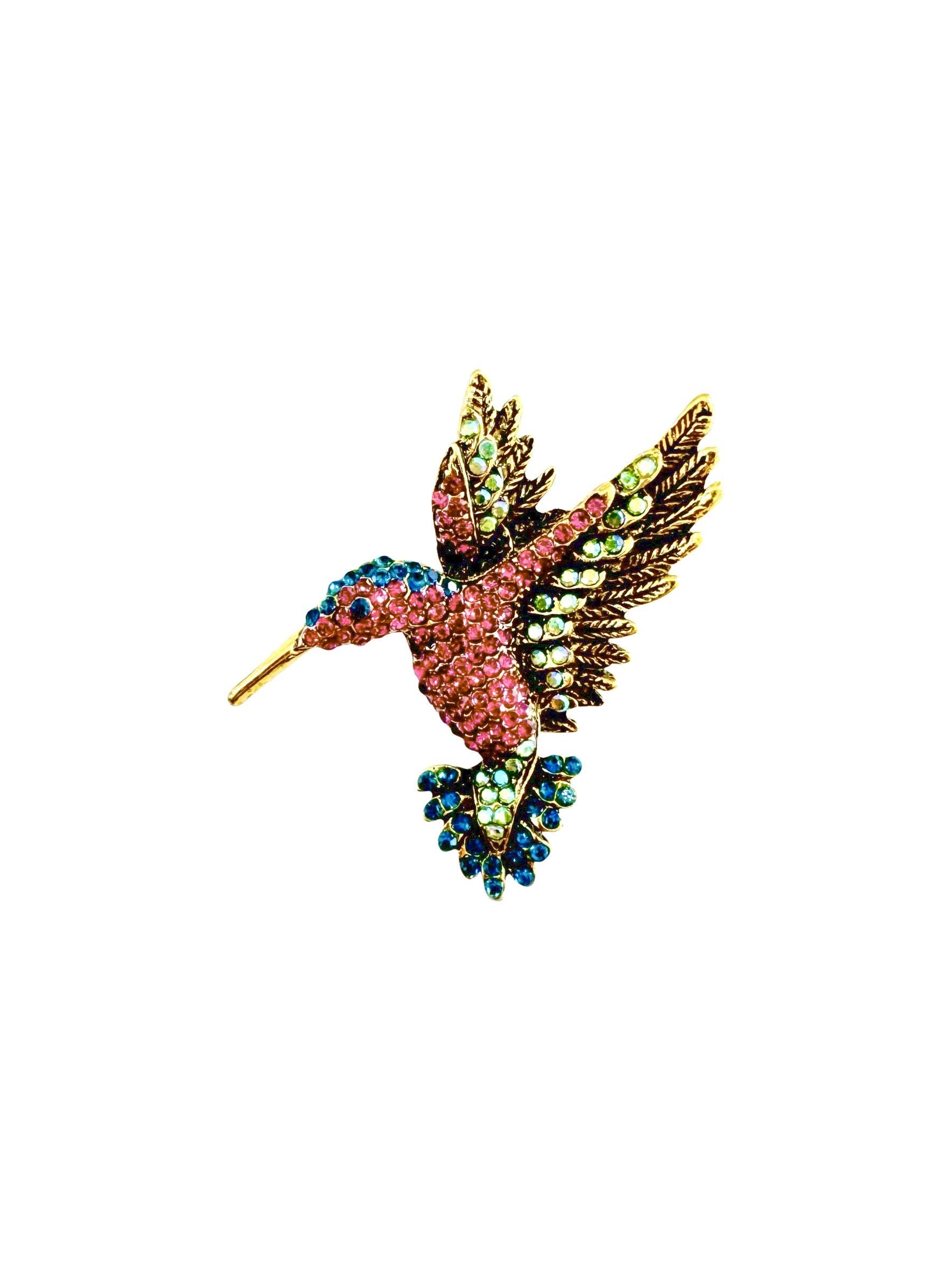 Gemelli hummingbird brooch featuring intricate detailing and vibrant colors, showcasing a beautiful bird design.