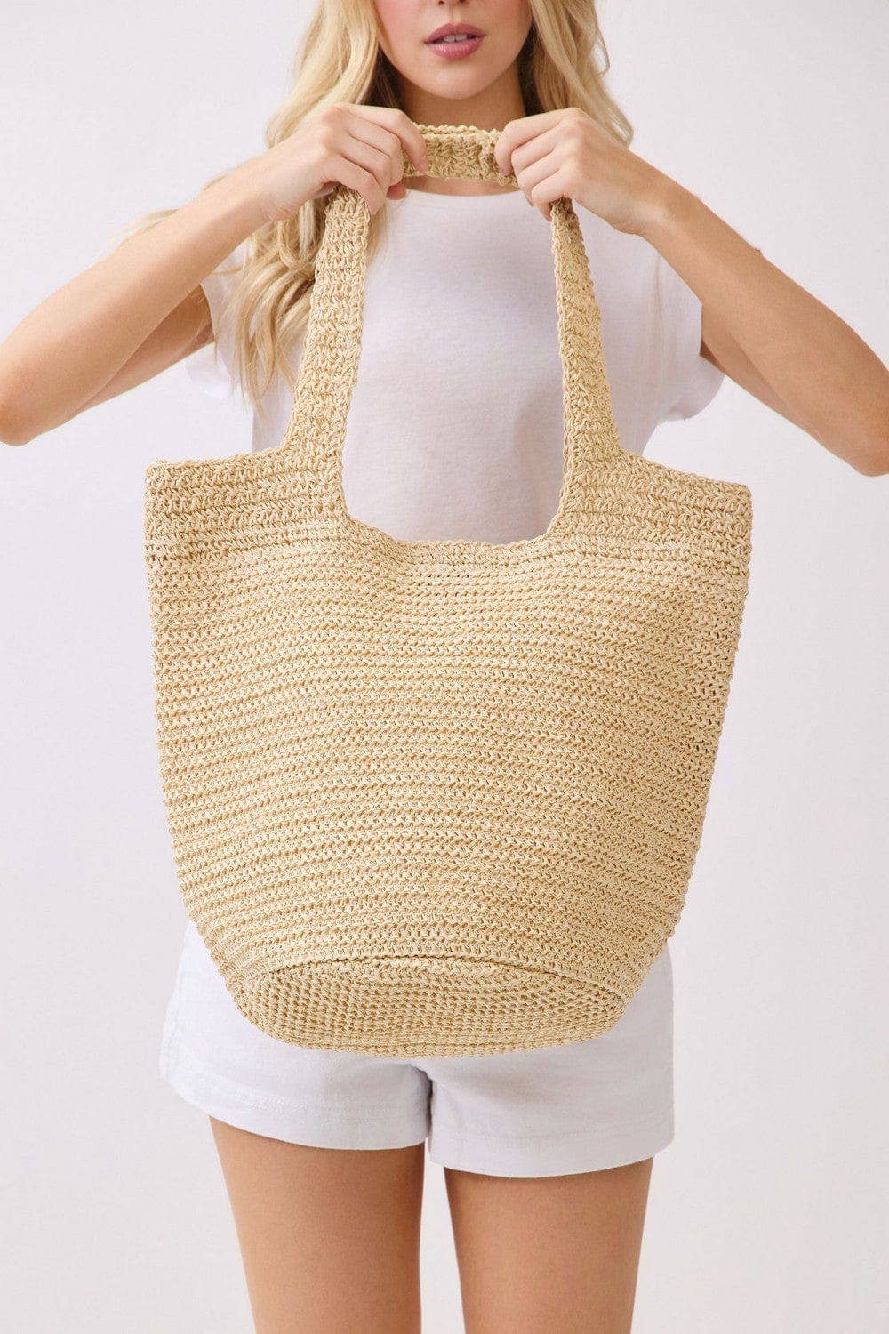 Handmade straw tote bag with leather handles, natural woven design, by Private Label, perfect for casual and summer outings.