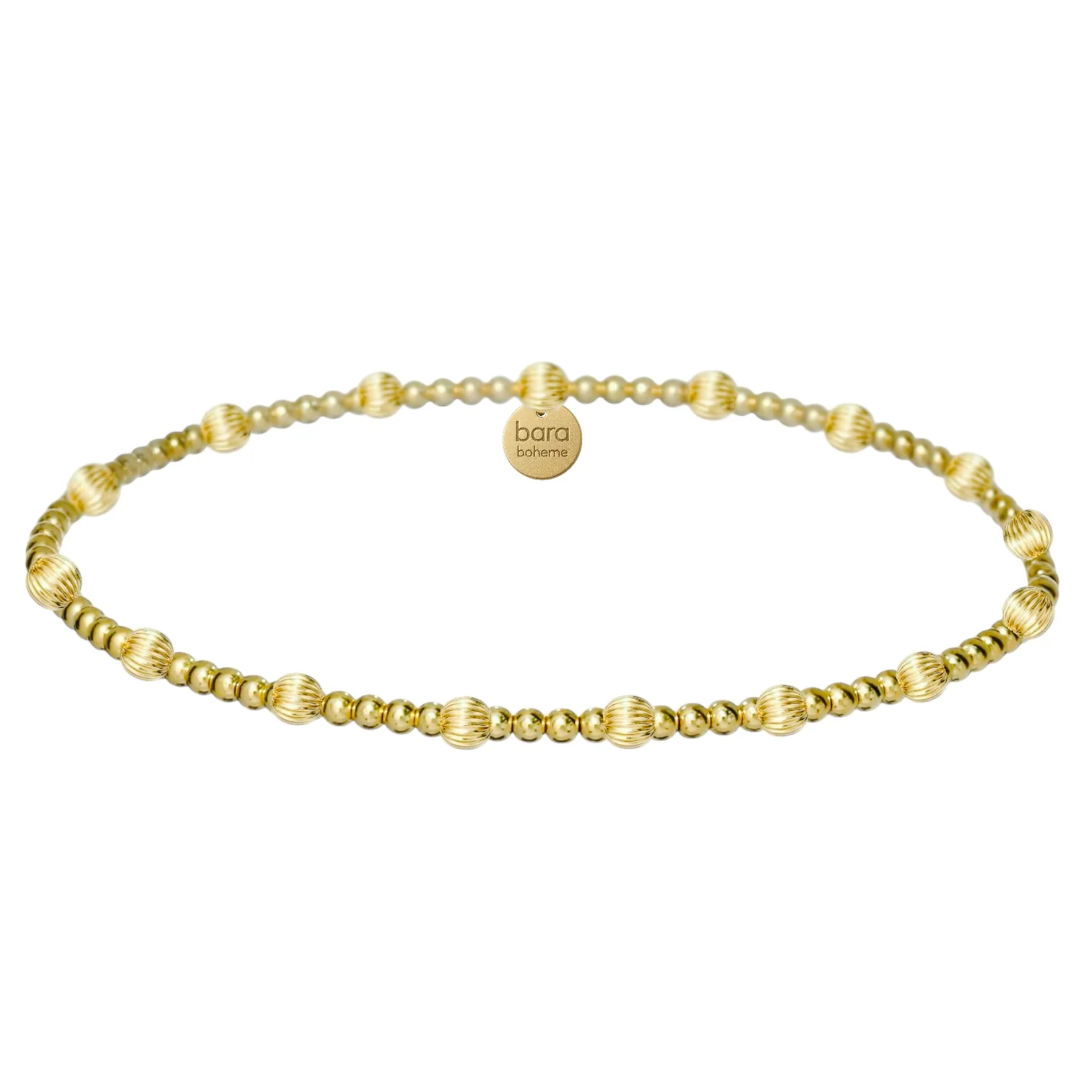 Gold filled beaded bracelet by BARA BOHEME, showcasing delicate beads and a stylish design on a white background.