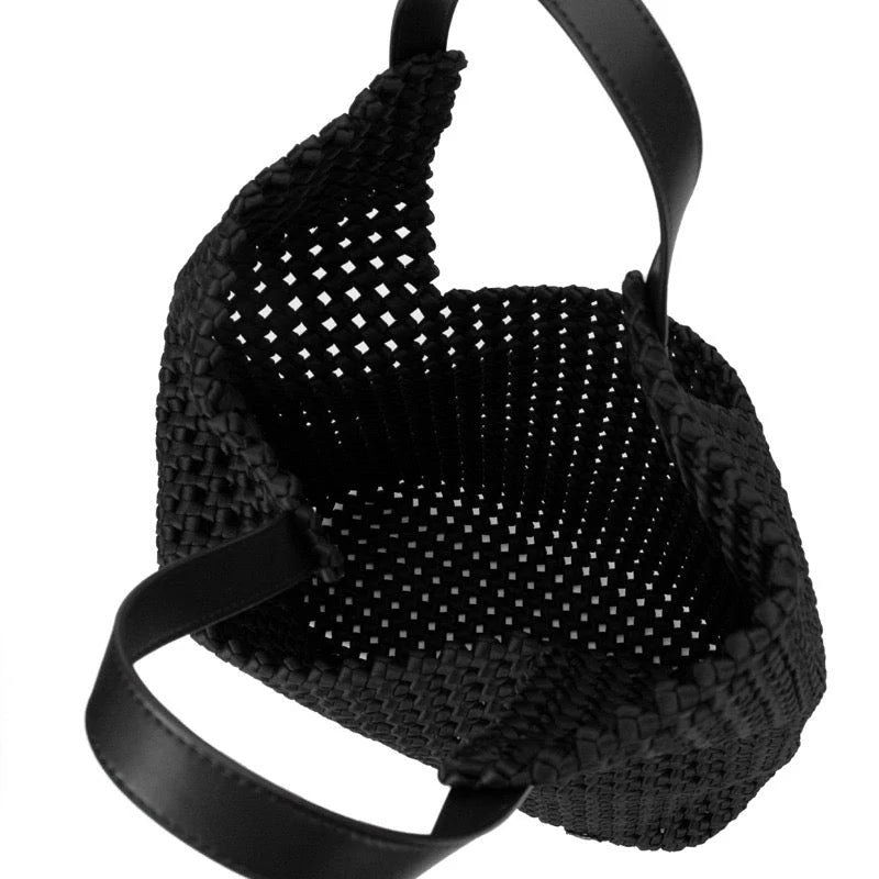 Black Eston woven tote handbag by Prenelove with sturdy handles and intricate woven design, perfect for everyday use.